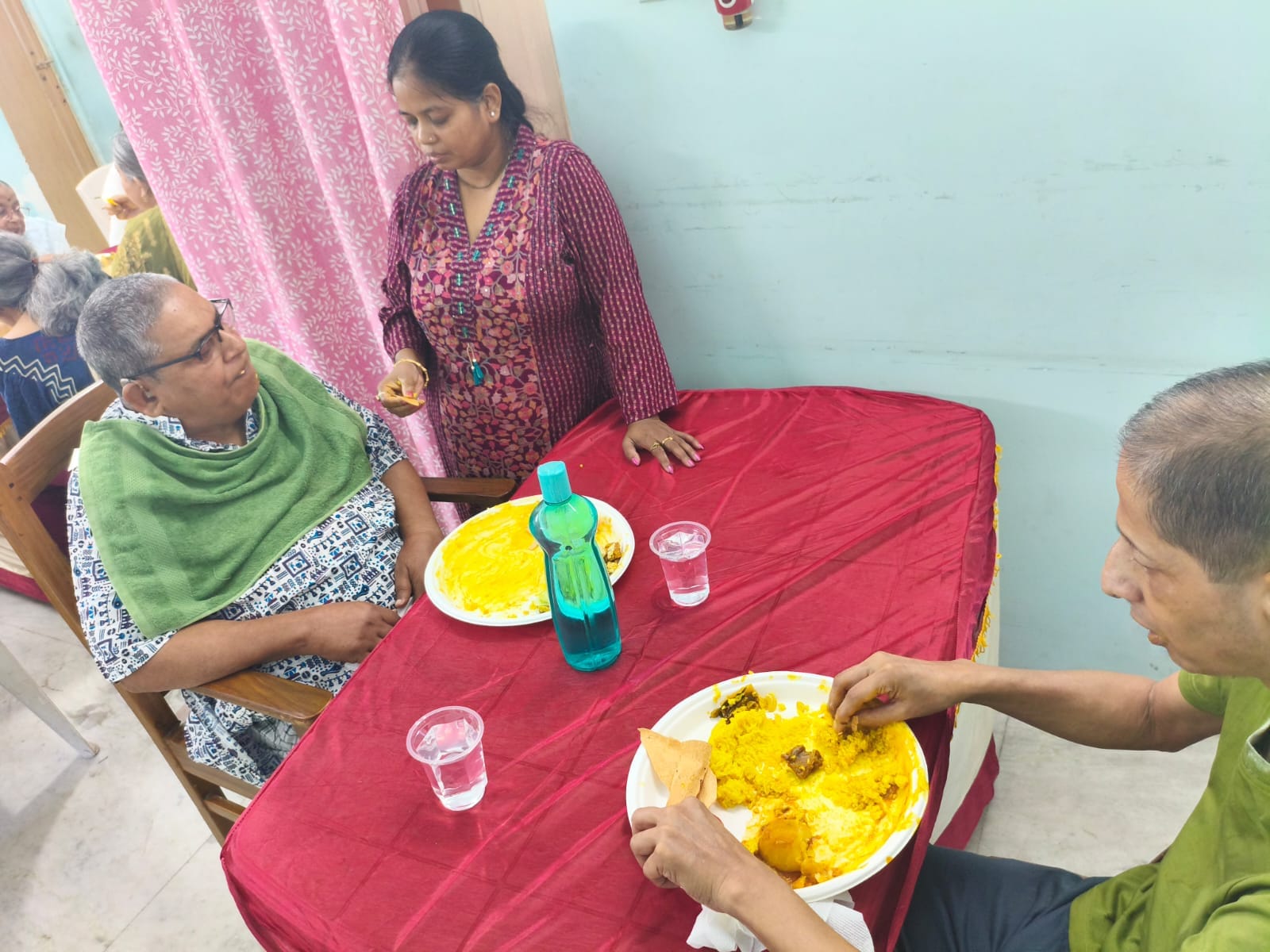 Happy senior living in Kolkata – smiling elderly woman with caregiver